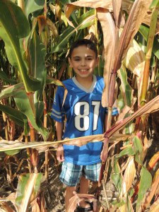 My picky Ryan in the cornfield behind our orchard.