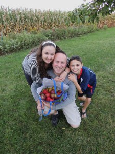 Dan and the kids in our orchard.